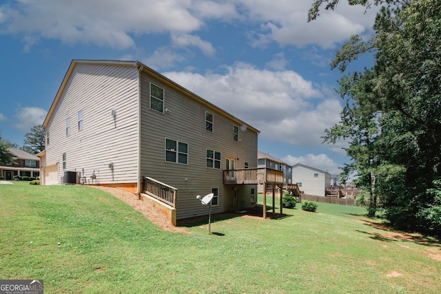 2405 Brisbane Dr, Conyers, GA 30013 - rear view of property with cooling unit, a yard, and a deck