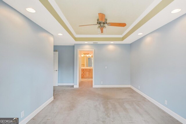 175 Palmera Ln, Brunswick, GA 31525 - empty room featuring a tray ceiling, a ceiling fan, crown molding, recessed lighting, and baseboards