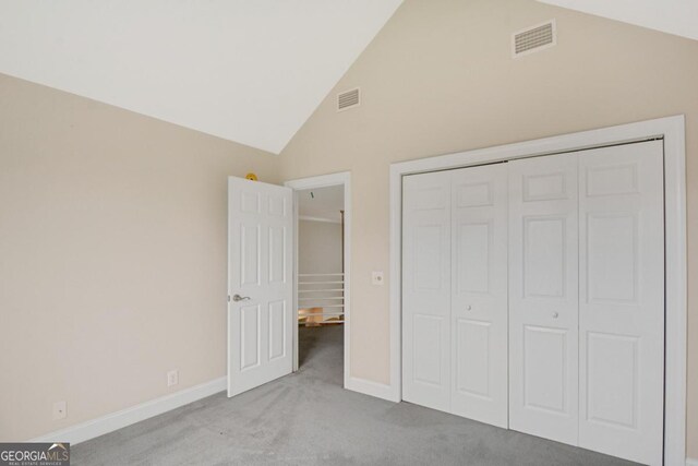 175 Palmera Ln, Brunswick, GA 31525 - unfurnished bedroom featuring carpet, baseboards, a closet, and high vaulted ceiling