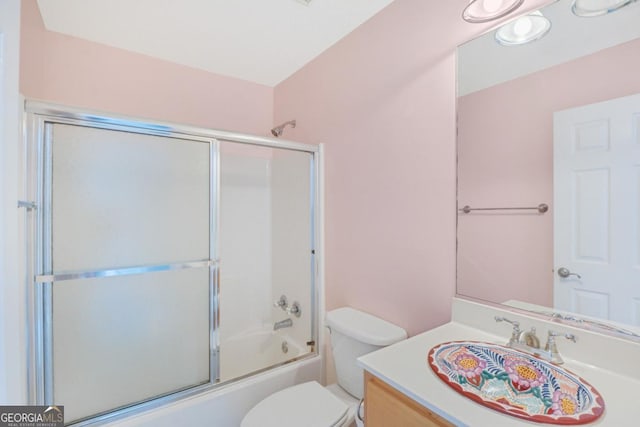175 Palmera Ln, Brunswick, GA 31525 - bathroom featuring toilet, vanity, and shower / bath combination with glass door