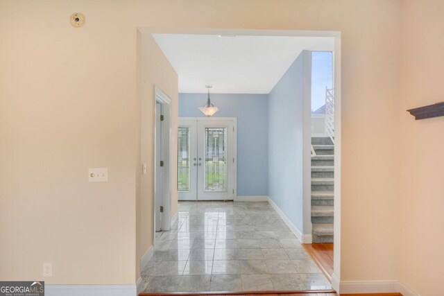 175 Palmera Ln, Brunswick, GA 31525 - hall with stairway, french doors, and baseboards