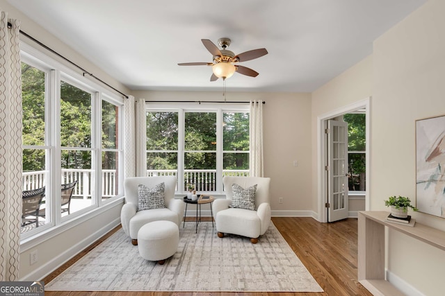 210 Wentworth Ter, Alpharetta, GA 30022 - sitting room with plenty of natural light, wood finished floors, and a ceiling fan