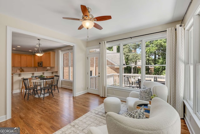 210 Wentworth Ter, Alpharetta, GA 30022 - living room with healthy amount of natural light, ceiling fan, and wood finished floors