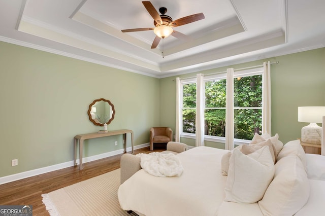 210 Wentworth Ter, Alpharetta, GA 30022 - bedroom with a tray ceiling, ornamental molding, wood finished floors, and baseboards