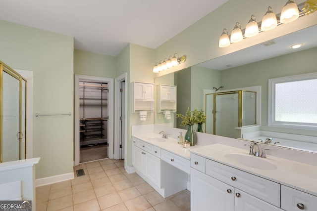 210 Wentworth Ter, Alpharetta, GA 30022 - full bathroom featuring a shower stall, tile patterned floors, a spacious closet, double vanity, and baseboards