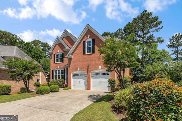 210 Wentworth Ter, Alpharetta, GA 30022 - traditional-style house featuring concrete driveway, brick siding, and an attached garage