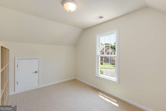 210 Wentworth Ter, Alpharetta, GA 30022 - additional living space with lofted ceiling, carpet floors, and baseboards