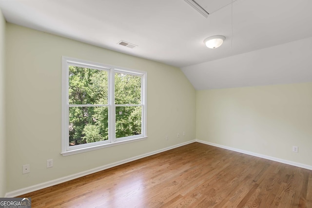 210 Wentworth Ter, Alpharetta, GA 30022 - additional living space featuring wood finished floors, lofted ceiling, attic access, and baseboards