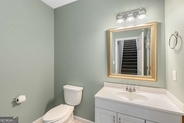 210 Wentworth Ter, Alpharetta, GA 30022 - bathroom with toilet, vanity, and baseboards