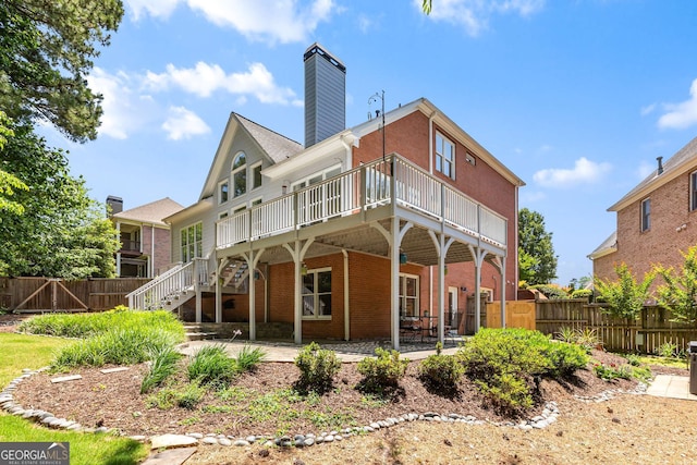 210 Wentworth Ter, Alpharetta, GA 30022 - rear view of property with a deck, brick siding, a chimney, stairway, and a patio area