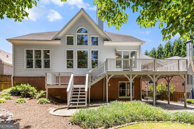 210 Wentworth Ter, Alpharetta, GA 30022 - rear view of property with a wooden deck, stairway, a chimney, and brick siding