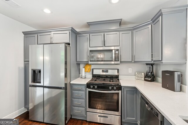 1605 Wellswood Dr SE, Atlanta, GA 30315 - kitchen featuring stainless steel appliances, gray cabinetry, recessed lighting, baseboards, and dark wood finished floors