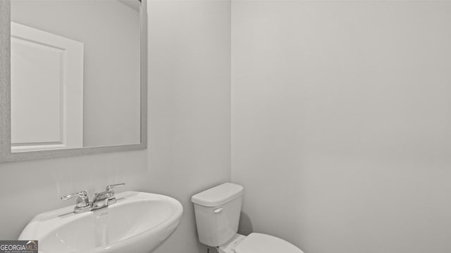 bathroom with a sink and toilet