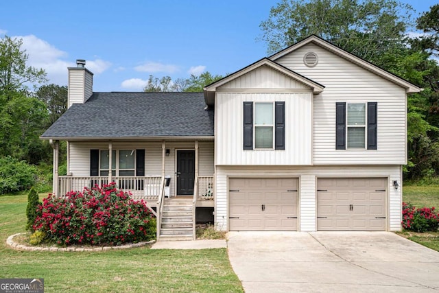 1605 Deer Creek Ln, Monroe, GA 30655 - tri-level home with a garage, a chimney, a porch, driveway, and a front lawn