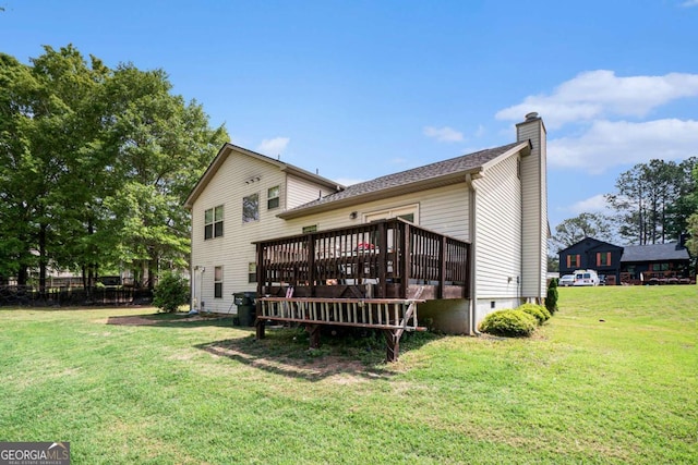 1605 Deer Creek Ln, Monroe, GA 30655 - back of property with a chimney, a wooden deck, and a yard