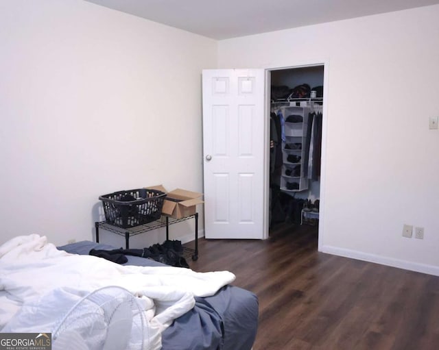 250 Little St Unit B206, Athens, GA 30605 - bedroom with wood finished floors, a closet, baseboards, and a walk in closet