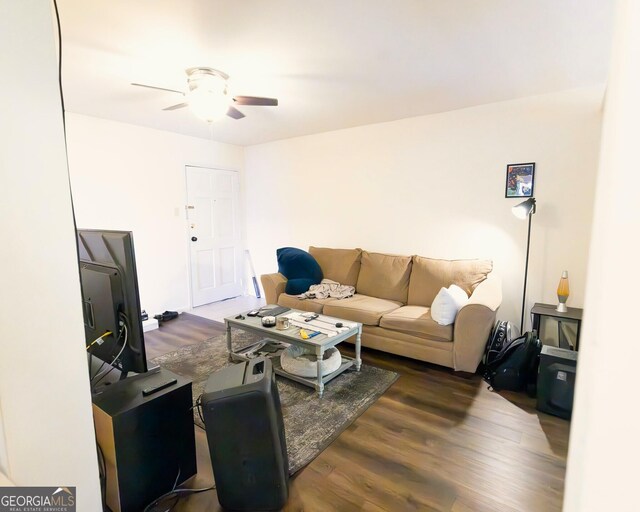 living area with ceiling fan and wood finished floors
