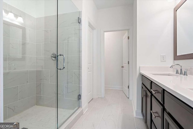 1309 Bennett Creek Ovlk, Suwanee, GA 30024 - bathroom featuring a shower stall, baseboards, marble look tiles, and vanity