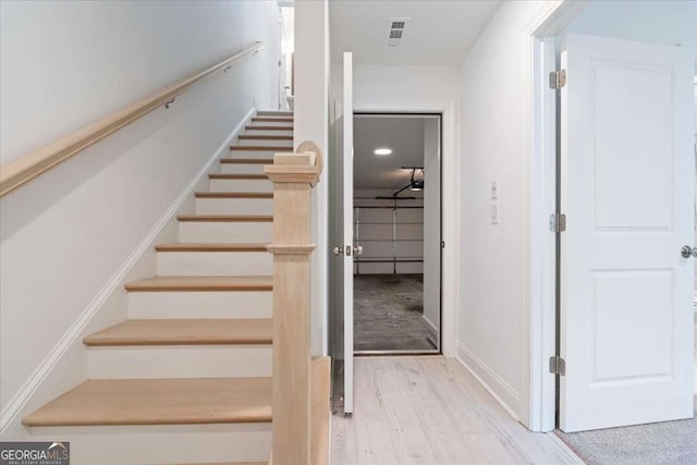 1309 Bennett Creek Ovlk, Suwanee, GA 30024 - stairs with wood finished floors and baseboards
