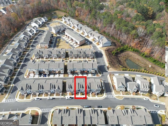 1309 Bennett Creek Ovlk, Suwanee, GA 30024 - aerial overview of property's location with nearby suburban area and a forest