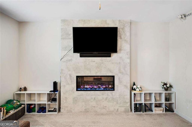 179 Leyland Xing, Dallas, GA 30132 - carpeted living room with a tile fireplace and baseboards