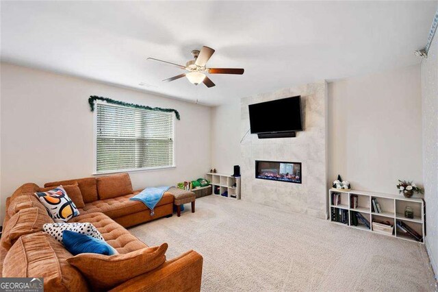 179 Leyland Xing, Dallas, GA 30132 - living room with carpet floors, a ceiling fan, and a multi sided fireplace