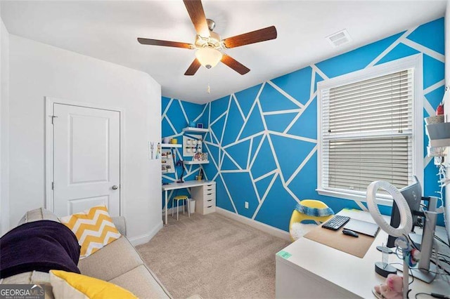179 Leyland Xing, Dallas, GA 30132 - home office featuring an accent wall, carpet floors, baseboards, and ceiling fan
