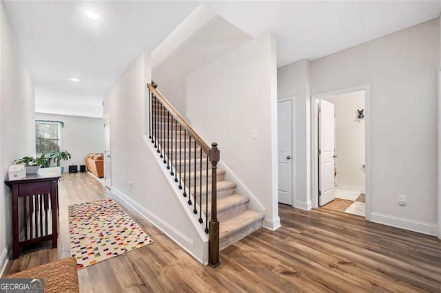 179 Leyland Xing, Dallas, GA 30132 - stairway featuring wood finished floors