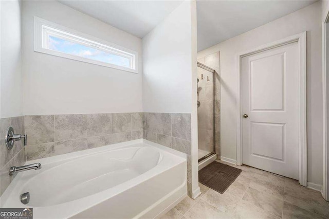 179 Leyland Xing, Dallas, GA 30132 - bathroom featuring a bath and a shower stall