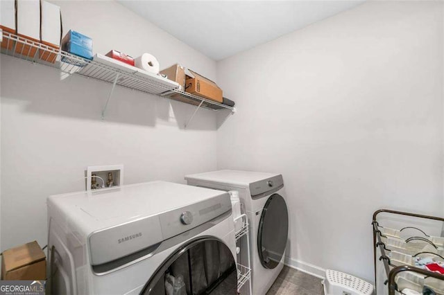 179 Leyland Xing, Dallas, GA 30132 - clothes washing area with separate washer and dryer and baseboards