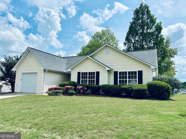 486 Village Cir, Stockbridge, GA 30281 - ranch-style house featuring a garage, a front yard, driveway, and a shingled roof