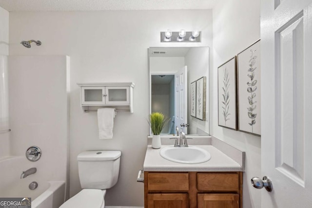 full bath with toilet, vanity, and bathing tub / shower combination