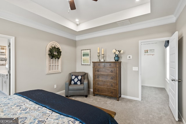 carpeted bedroom with crown molding, baseboards, a tray ceiling, and a ceiling fan