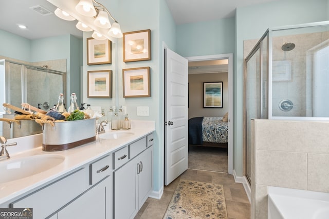 full bathroom featuring a shower stall, double vanity, a tub, and tile patterned floors