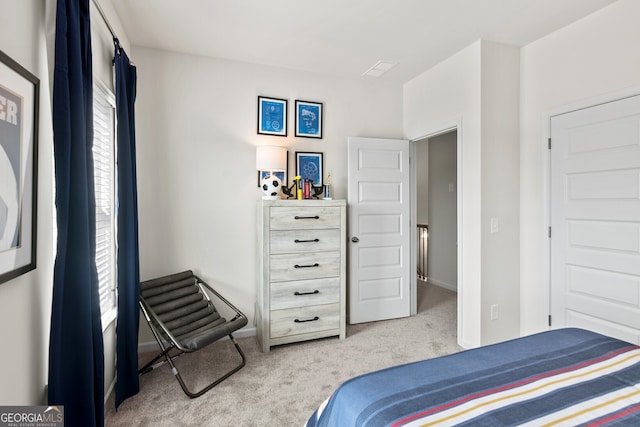 carpeted bedroom with baseboards