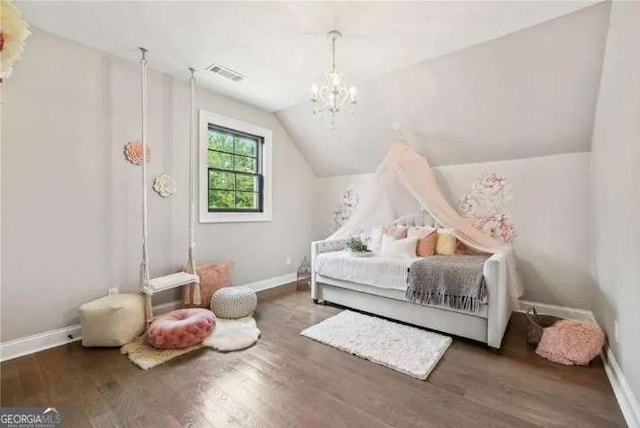 2242 Shoal Creek Rd, Buford, GA 30518 - bedroom featuring wood finished floors, lofted ceiling, baseboards, and a chandelier