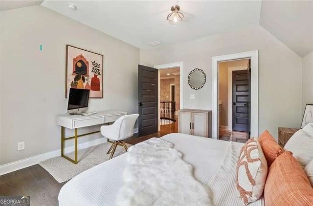 2242 Shoal Creek Rd, Buford, GA 30518 - bedroom featuring lofted ceiling, wood finished floors, and baseboards