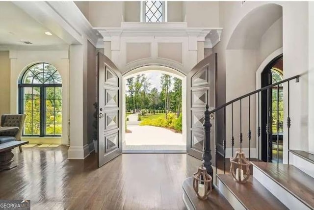 2242 Shoal Creek Rd, Buford, GA 30518 - foyer with wood finished floors, a high ceiling, baseboards, and stairs