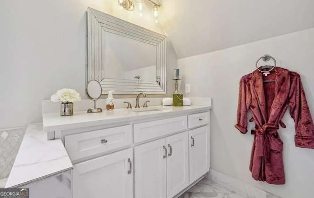 2242 Shoal Creek Rd, Buford, GA 30518 - bathroom featuring marble look tile flooring, vanity, and lofted ceiling