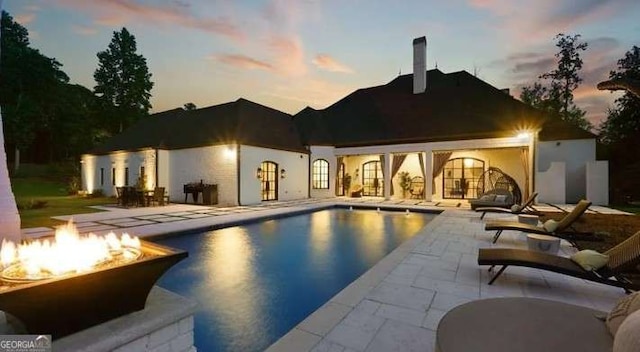 2242 Shoal Creek Rd, Buford, GA 30518 - outdoor pool with an outdoor fire pit and a patio