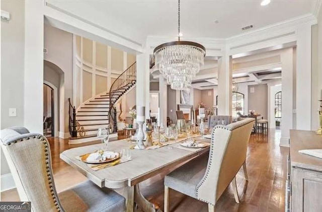 2242 Shoal Creek Rd, Buford, GA 30518 - dining area with a chandelier, wood finished floors, stairs, crown molding, and coffered ceiling