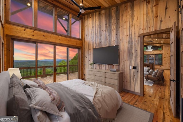 885 Tower Rd, Mineral Bluff, GA 30559 - bedroom featuring high vaulted ceiling, wood walls, wooden ceiling, wood-type flooring, and access to outside