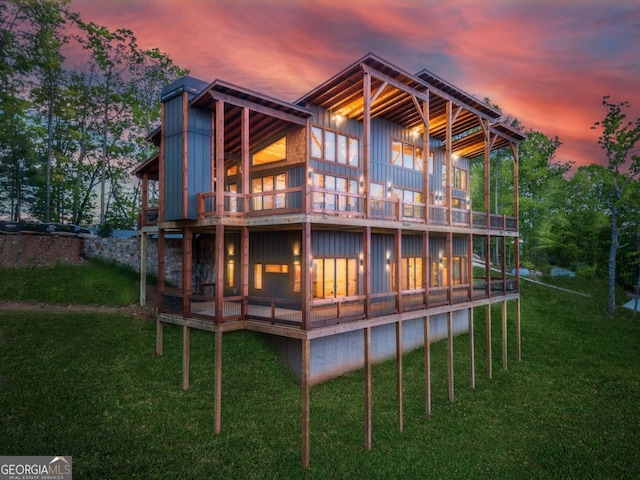885 Tower Rd, Mineral Bluff, GA 30559 - rear view of house with board and batten siding, a lawn, and a wooden deck