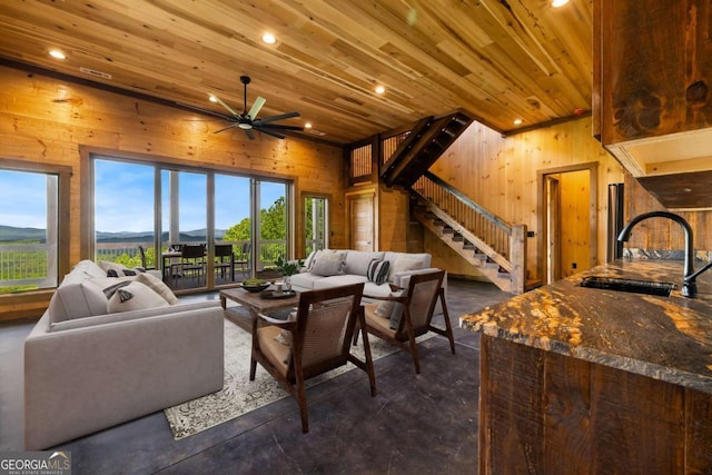 885 Tower Rd, Mineral Bluff, GA 30559 - living area with wood walls, stairs, wood ceiling, recessed lighting, and ceiling fan