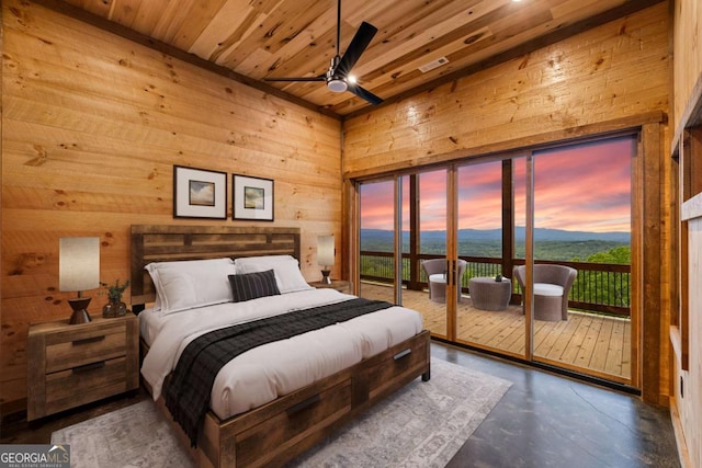 885 Tower Rd, Mineral Bluff, GA 30559 - bedroom featuring wood walls, access to outside, wood ceiling, finished concrete flooring, and ceiling fan