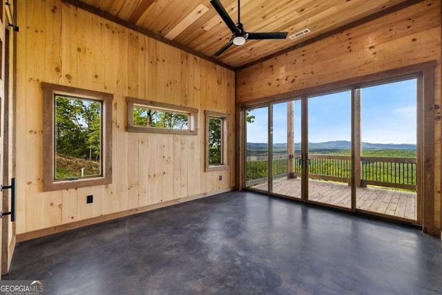 885 Tower Rd, Mineral Bluff, GA 30559 - spare room with finished concrete flooring, wooden walls, a mountain view, ceiling fan, and wooden ceiling