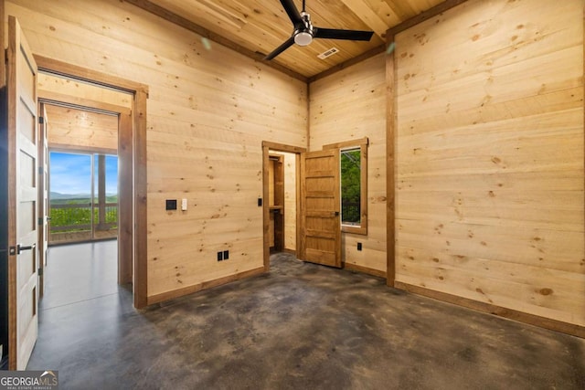885 Tower Rd, Mineral Bluff, GA 30559 - empty room with wood ceiling, concrete floors, ceiling fan, and wood walls