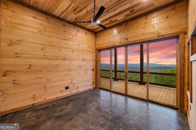 885 Tower Rd, Mineral Bluff, GA 30559 - empty room featuring concrete floors, ceiling fan, a mountain view, wood ceiling, and wooden walls