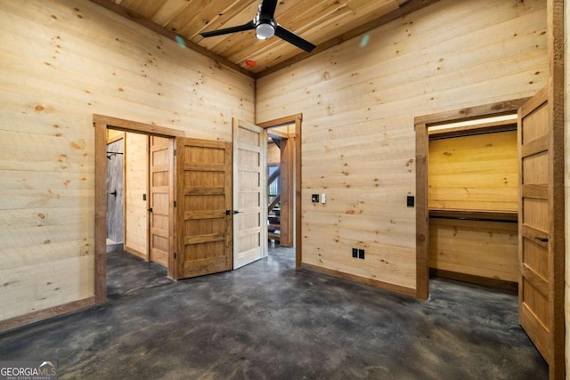 885 Tower Rd, Mineral Bluff, GA 30559 - unfurnished bedroom with wooden walls, concrete flooring, and wooden ceiling