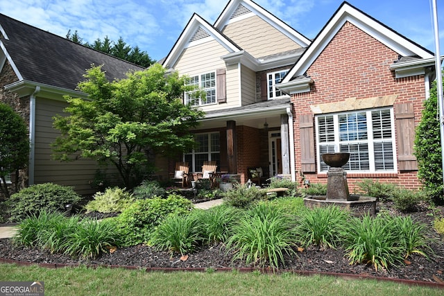 24 Douglas Dr, Jefferson, GA 30549 - view of front of property with brick siding, covered porch, and a shingled roof